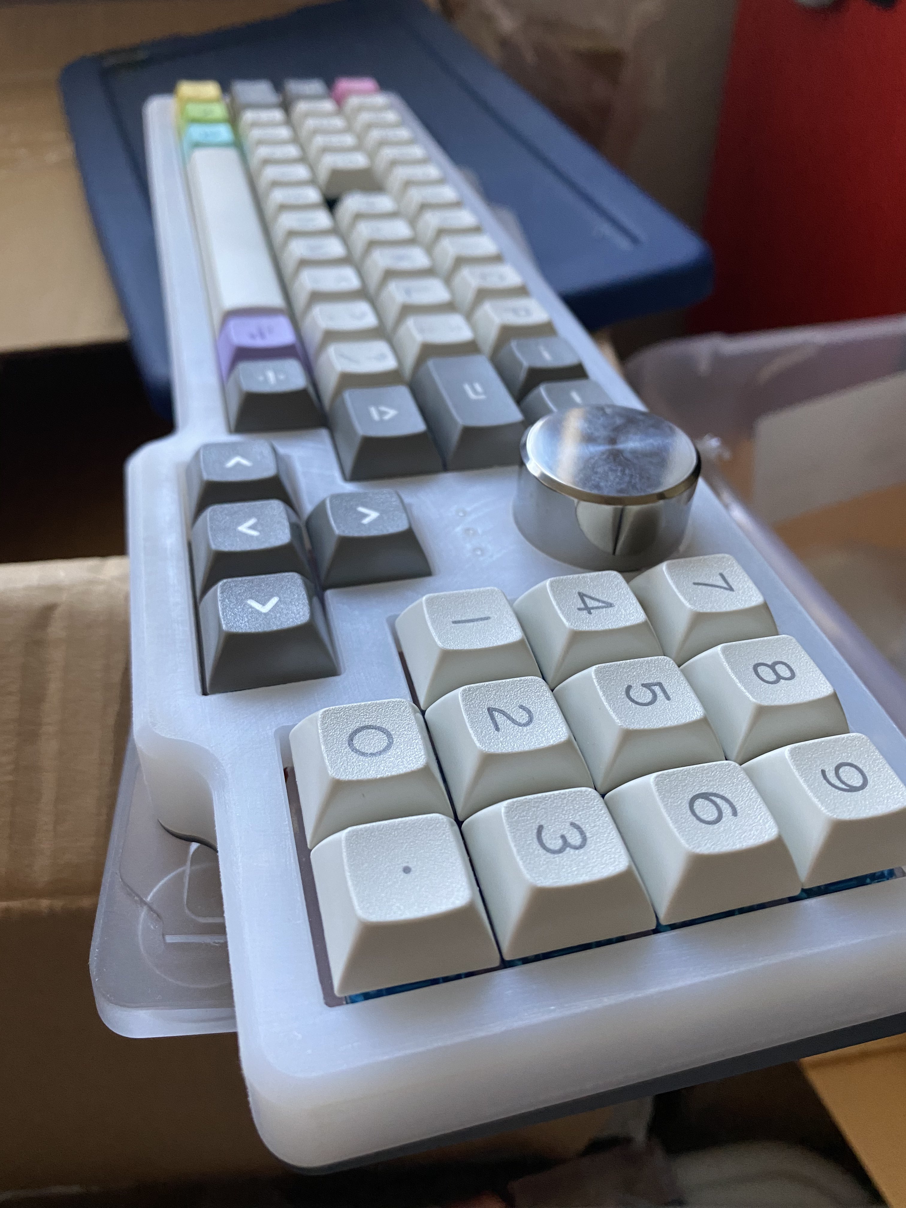 Prototype Garbage Truck case made from milled UHMWPE with a gray anodized aluminum bottom and DSA Paperwork keycaps