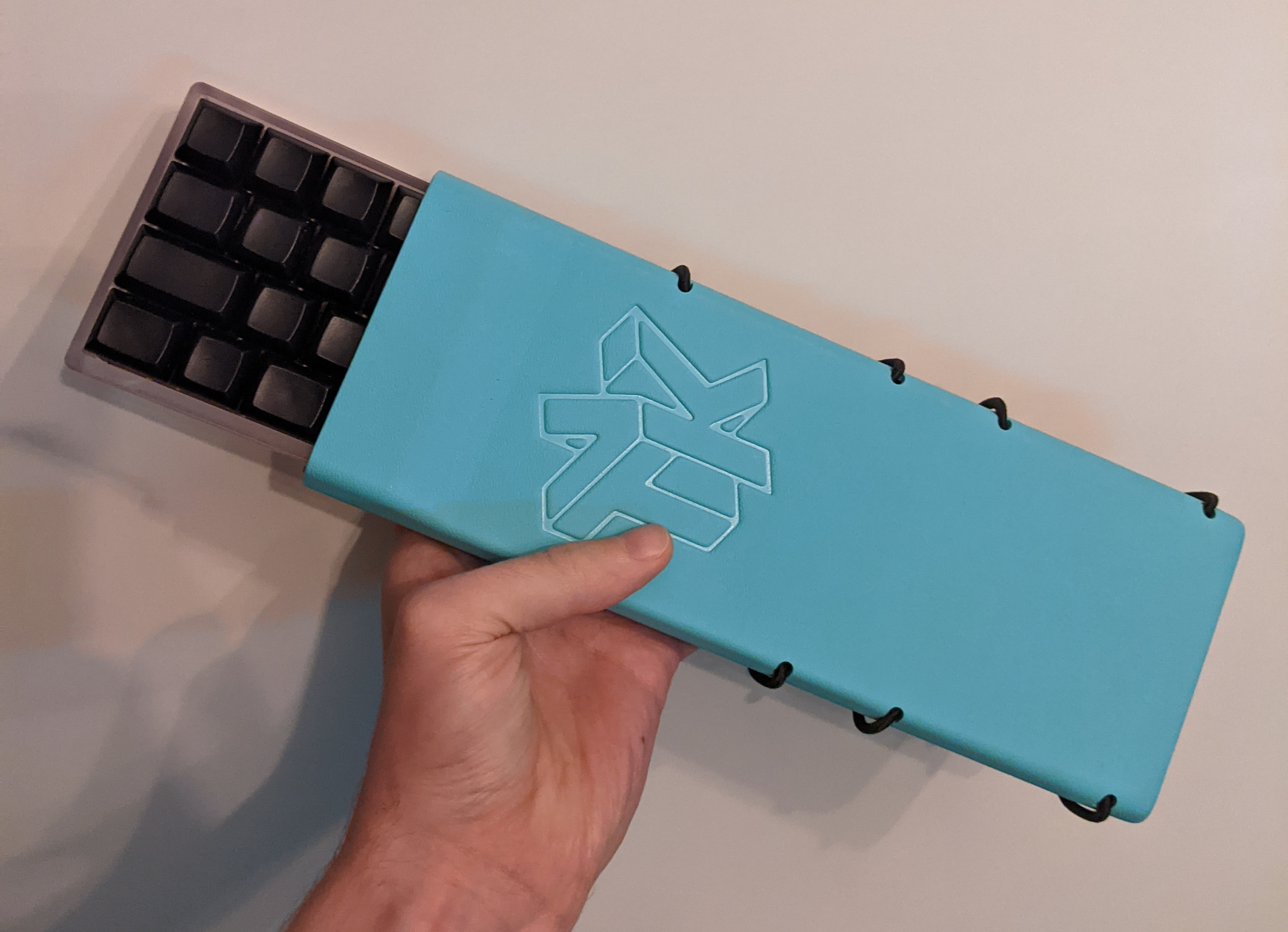 Blue Holster holding a KUMO with HuB keycaps