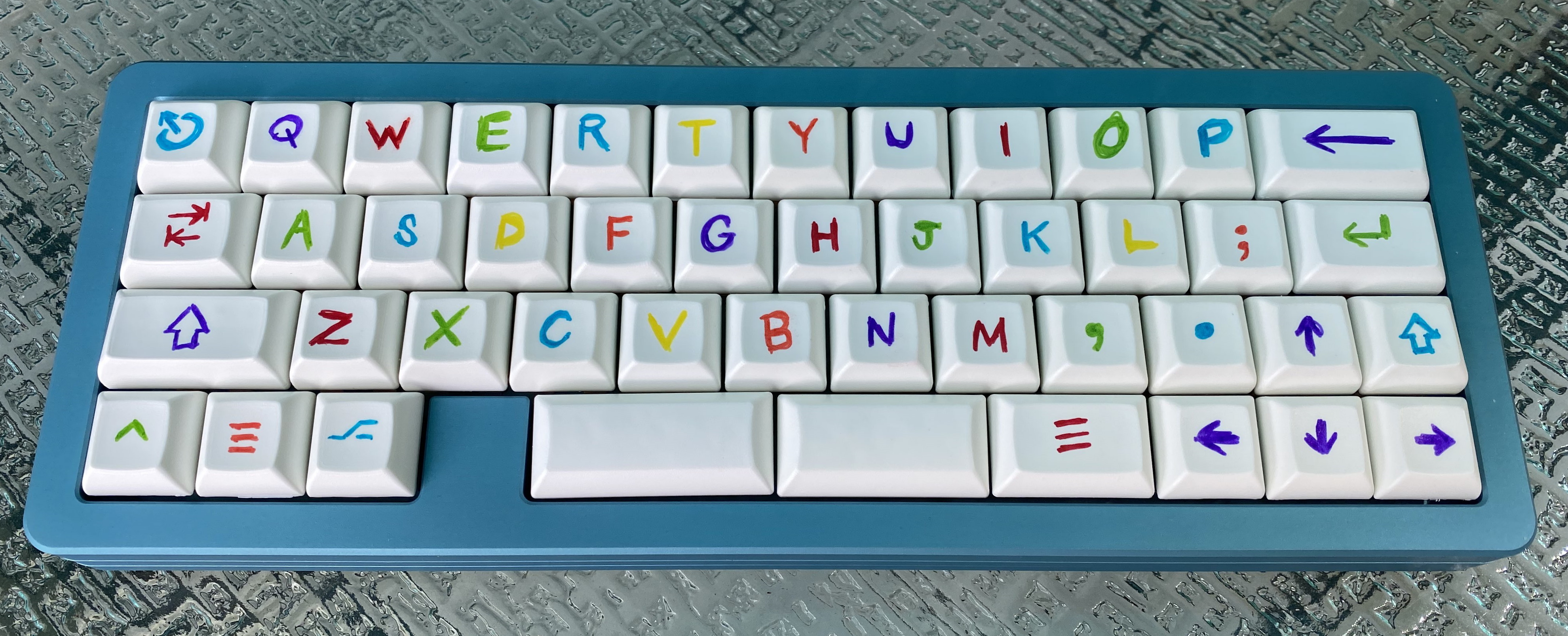 A set of custom dye-sublimated HuB Cool Kids keycaps on an MHKB