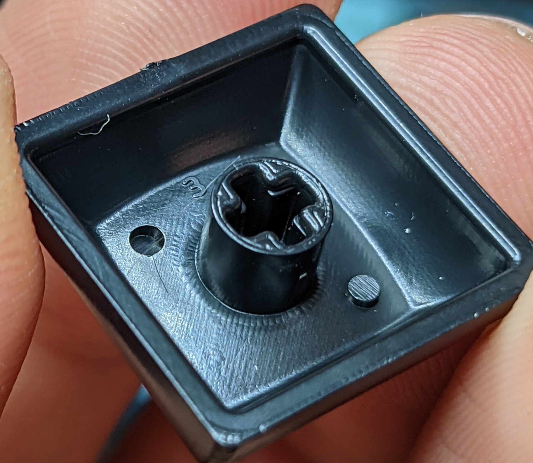 Closeup detail of the underside of a row 3 HuB keycap. The small '3' can be seen above the stem to indicate the row profile.