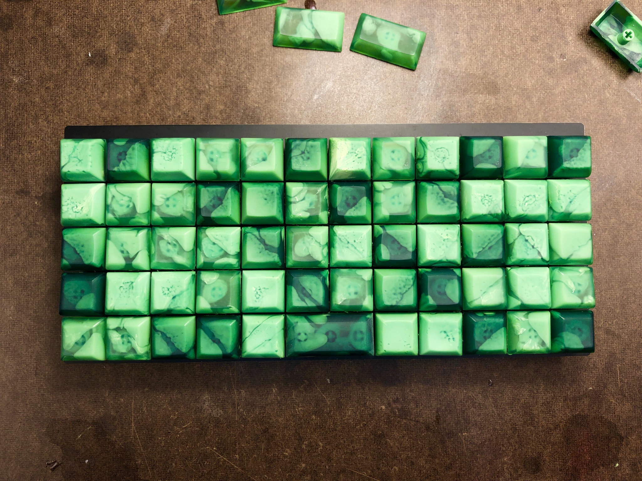 Green resin HuB keycaps on a Preonic