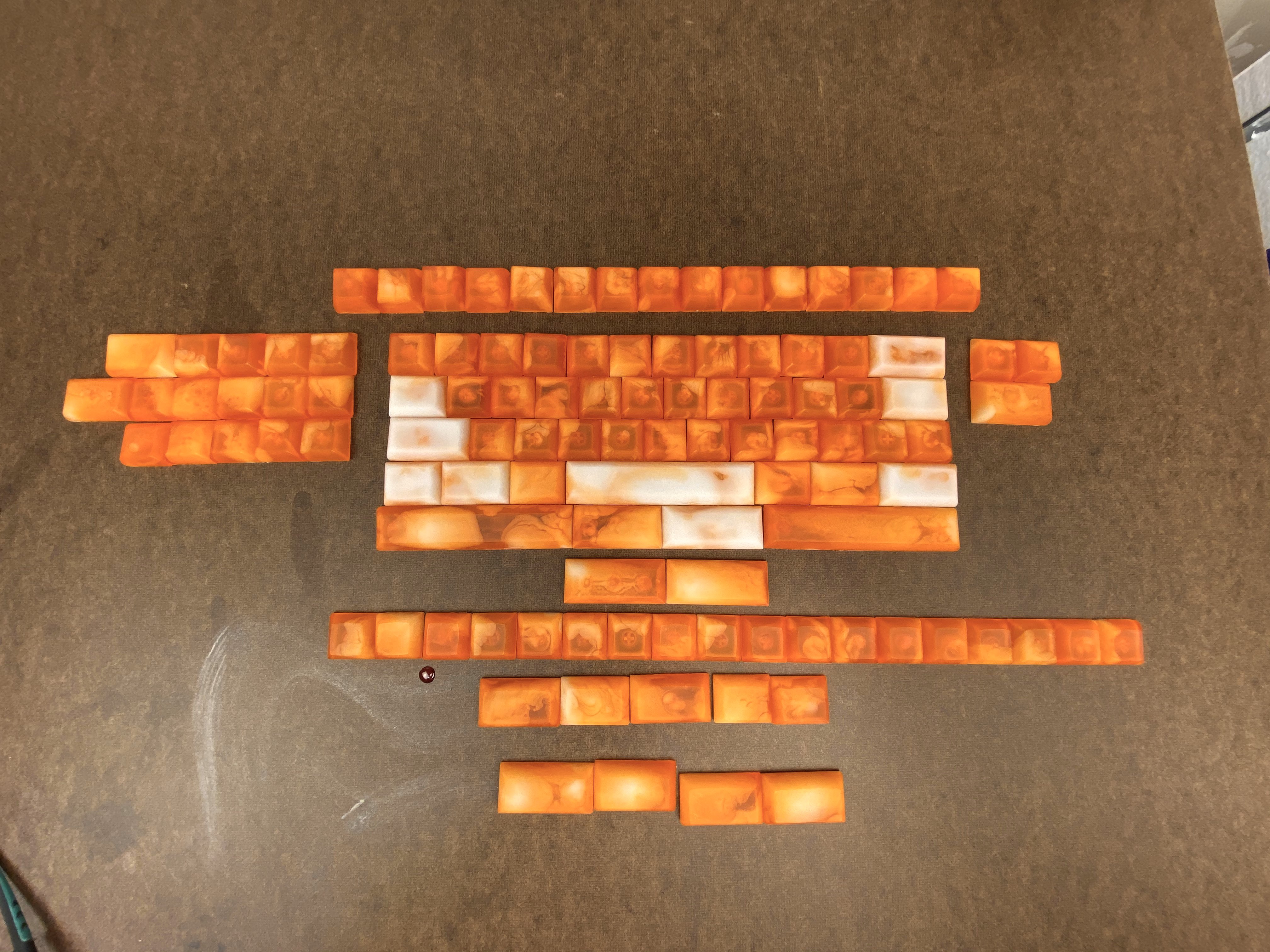 The full set of Creamsicle resin HuB keycaps