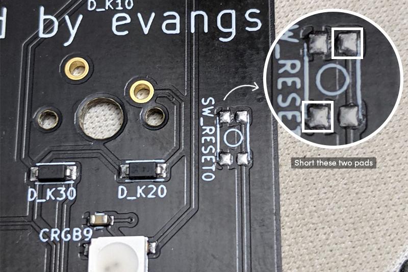 Short the two highlighted pads to put the board in bootloader mode.