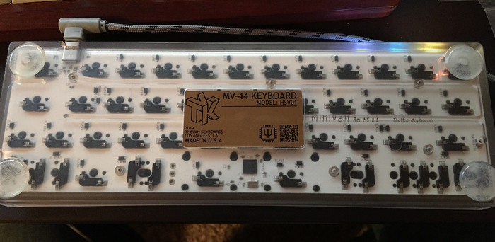 Backside of the clear KUMO case showing the hotswap sockets on the included PCB