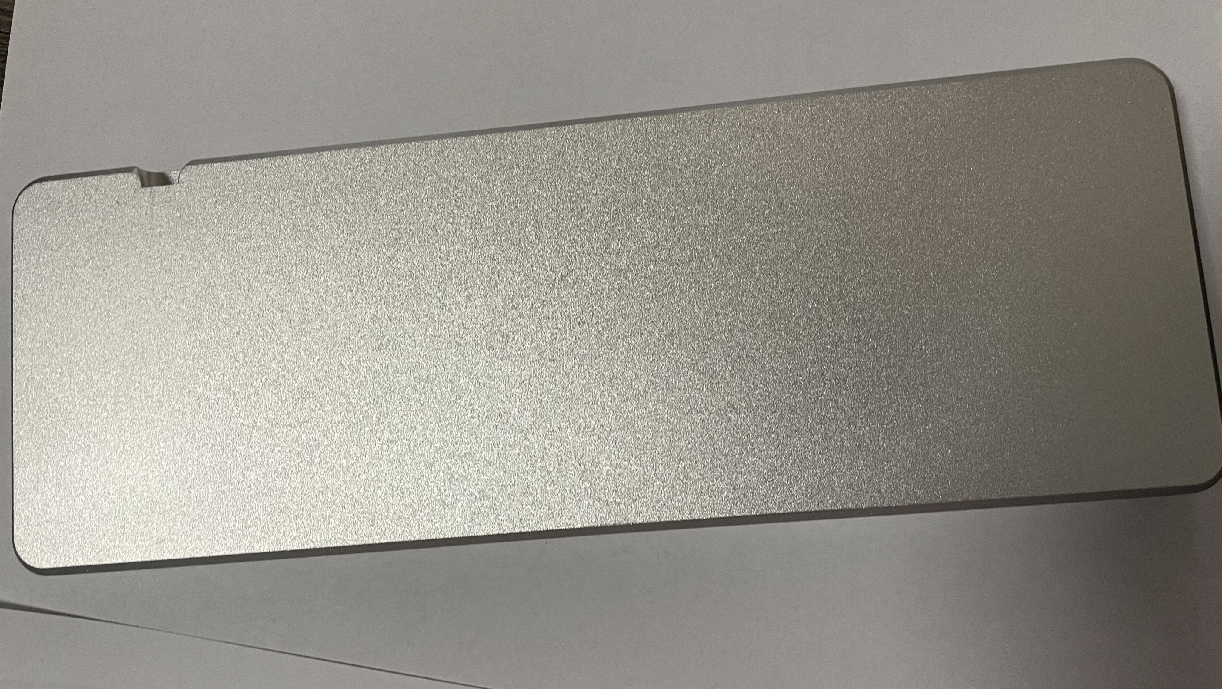 Bottom of a clear anodized aluminum 2nd revision prototype showing the sandblasted texture