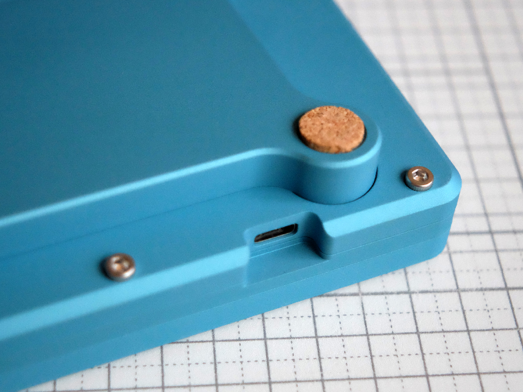 Closeup of MHKB USB port and optional 'SHU' case foot detail