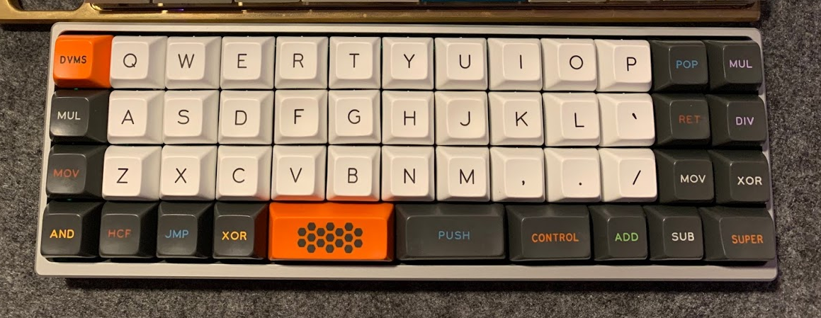 Minibaen with SA Carbon keycaps showing mixed ortholinear layout and staggered bottom row