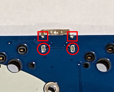 Solder points on the USB connector of a v1.1 Minisub PCB. Red squares have proper solder, red circles need additional solder.