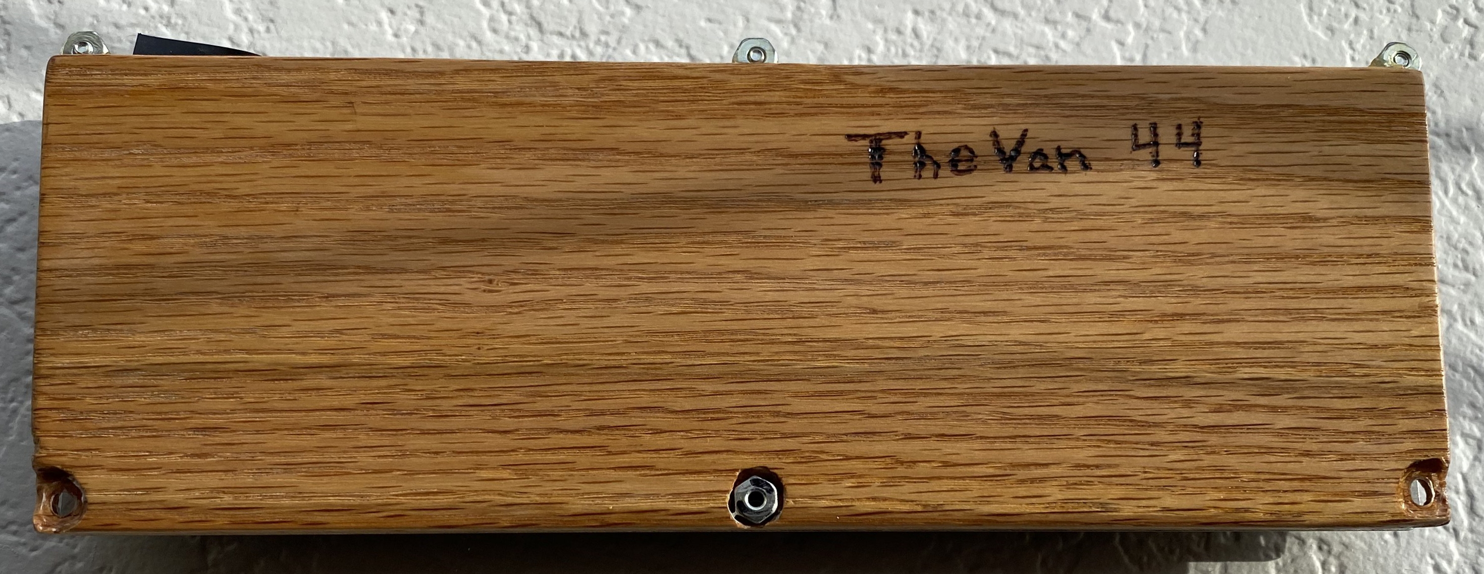The back of the prototype case with the original name of the board burned in with a soldering iron