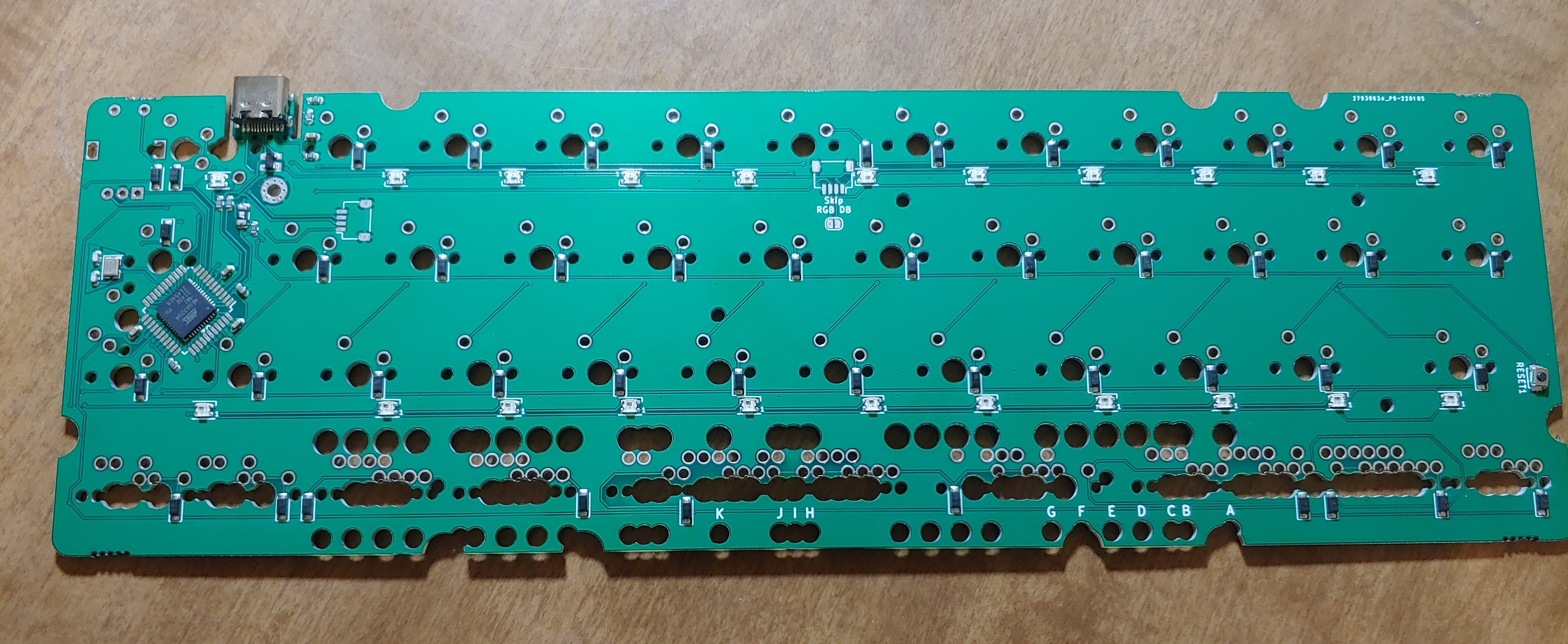 Back of a prototype Omnibus r4 PCB with the mounting tabs removed