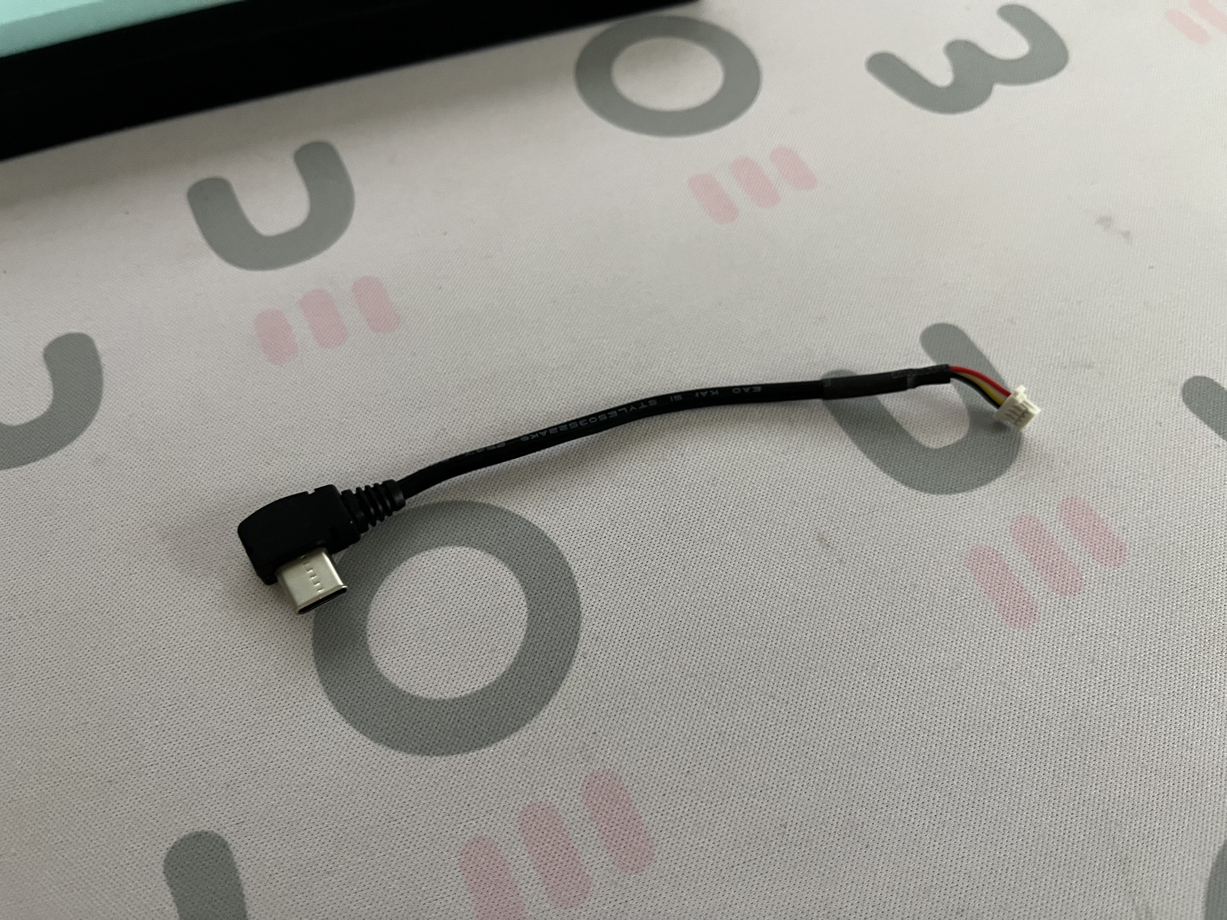 The custom JST-to-USB-C cable to support PCBs without daughterboard connectors