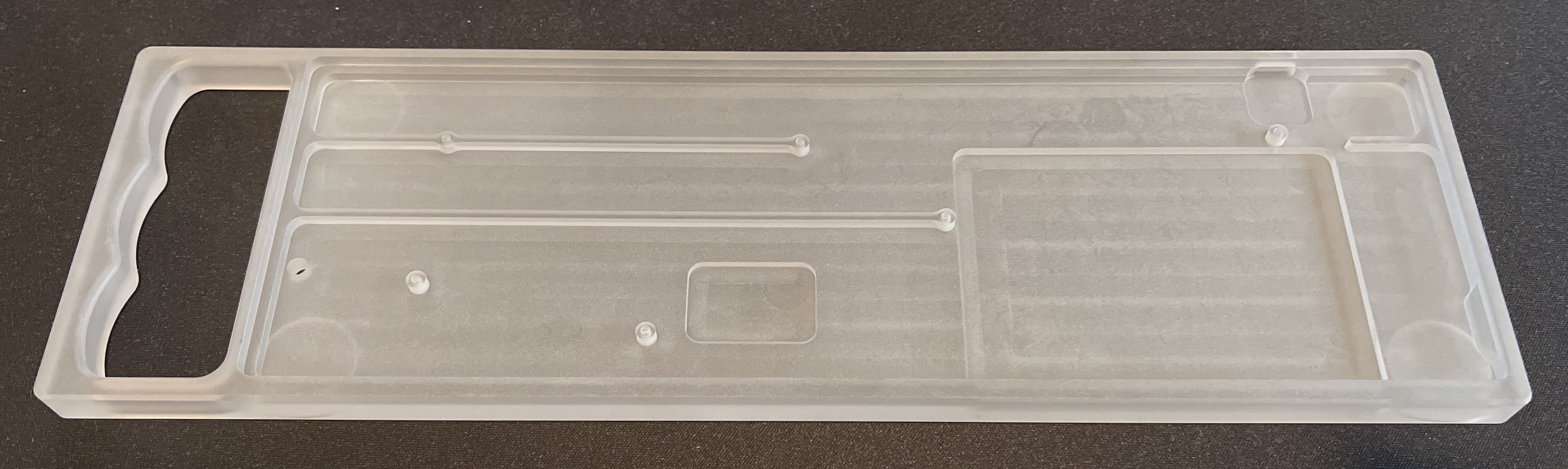 Top view of a polycarbonate Rackmount showing cutouts for the Bluetooth module (center) and battery well (right)