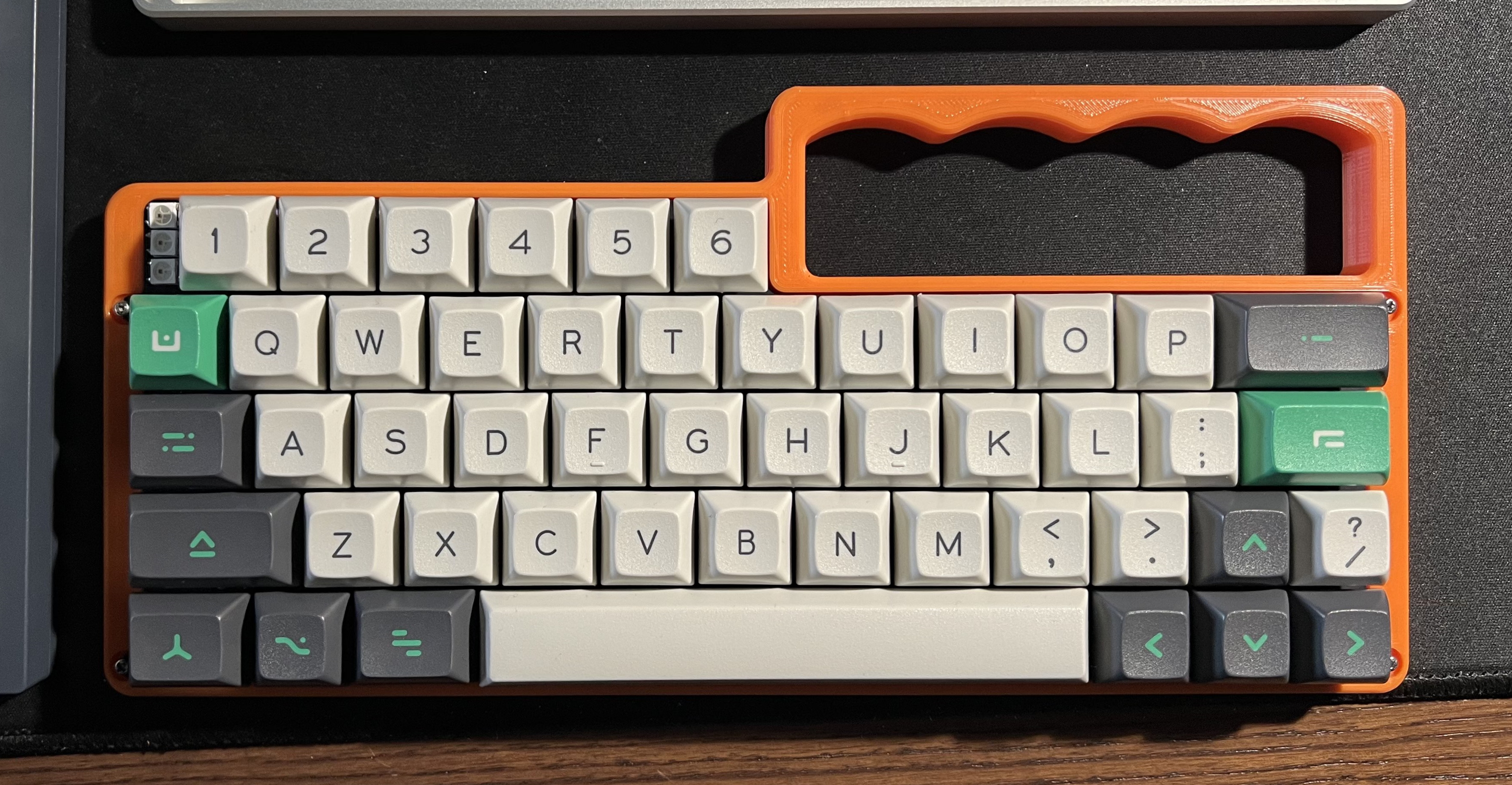 Orange Vandal with an R3 V4N4G0N plate and DSA Hullagon keycaps